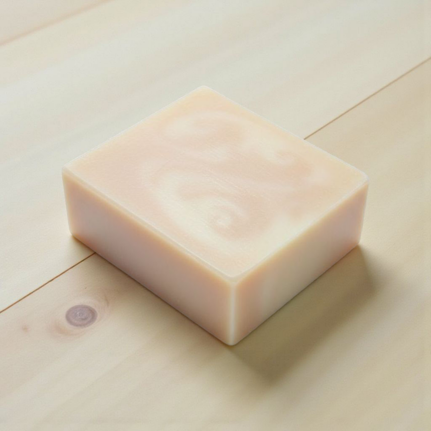 Bar of soap on a light wooden surface