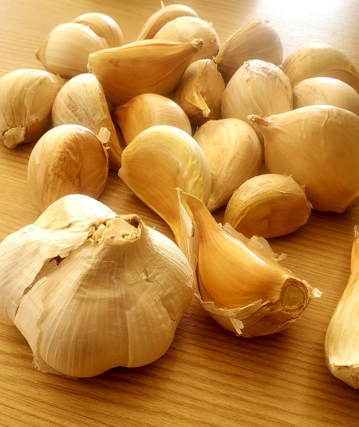 A close-up of garlic cloves and assorted vegetable foods, showcasing natural freshness and culinary inspiration.